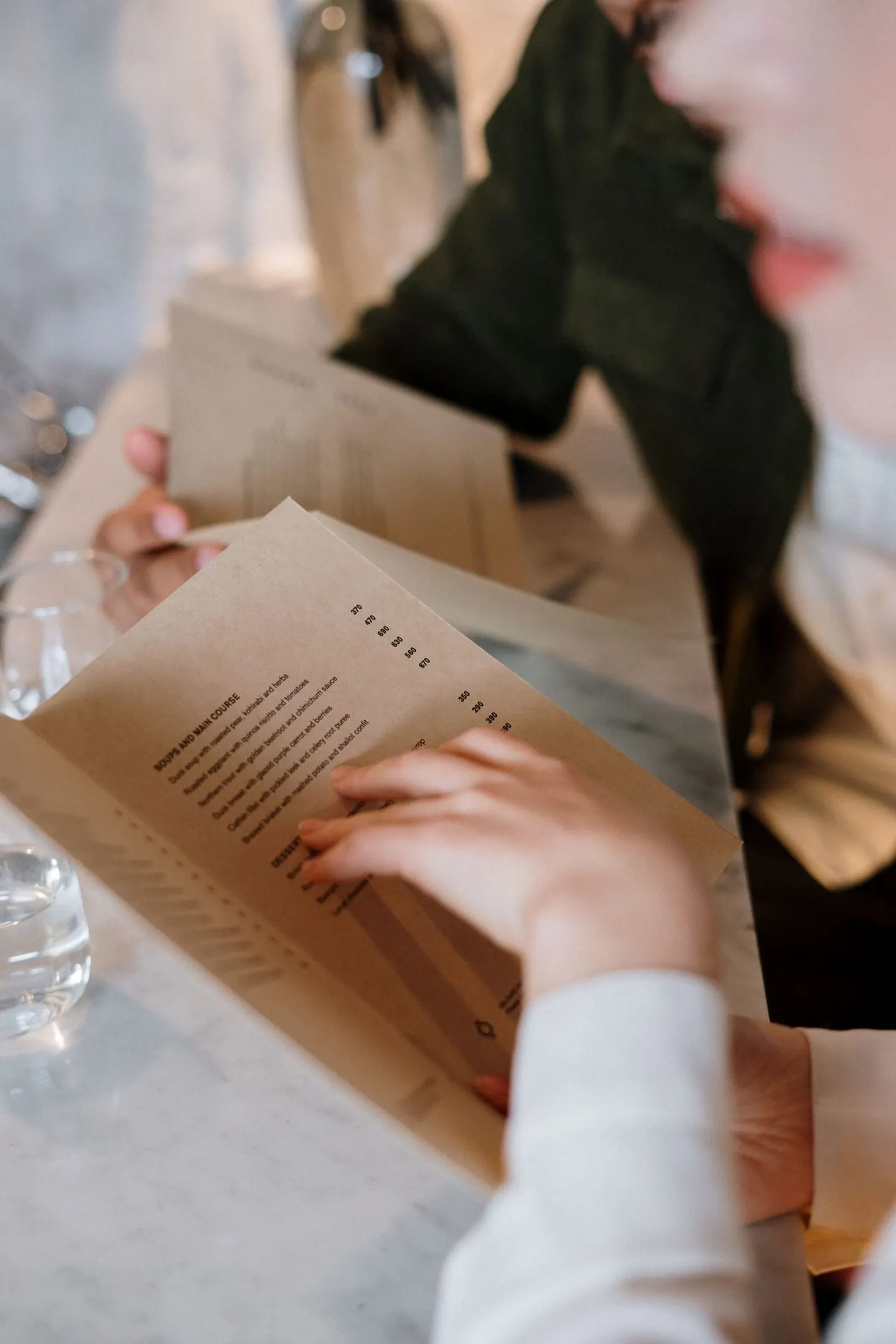 A couple looking over menu options together at a restaurant